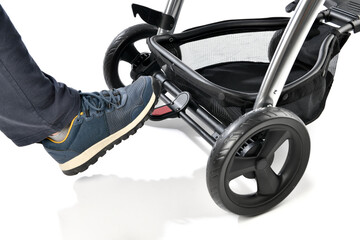 Baby stroller with brake isolated on white background.  
