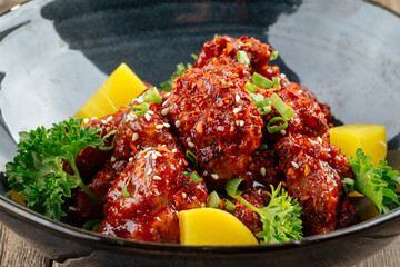 Asian marinated chicken in spicy sauce with daikon