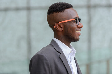 Young African businessman in the city outdoors