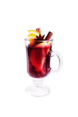 Mulled wine with slice of orange and spices isolated on white background