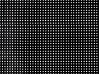 LED screen with digital dots on black background. Display texture