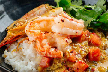 Asian dish curry with langoustines and hikari rice