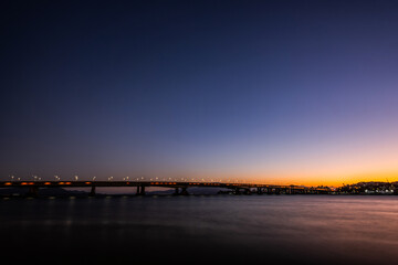 Bridges Pedro Ivo and Colombo Sales with reflection in water