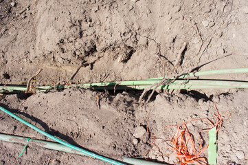 Excavated underground cables in the street in Elst, Netherlands