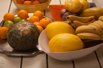 banana, melon, tangerine, passion fruit, papaya, pumpkin, lemon, orange