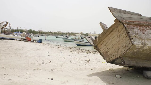 Beach in Muharraq with abandoned boats