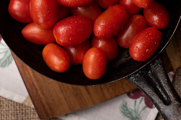 Fresh tomatoes on wooden table