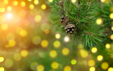 Obraz na płótnie Canvas Christmas tree card. Fir tree pine cones with beautiful garland bokeh lights