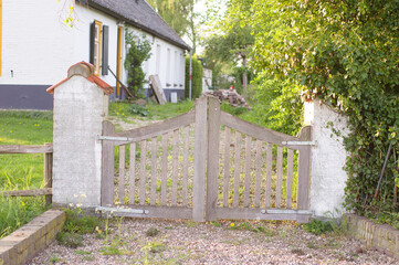 Ancient wooden closed gate that gives access to a barn