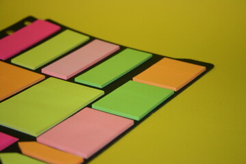 set of colorful stickers for notes on a yellow background