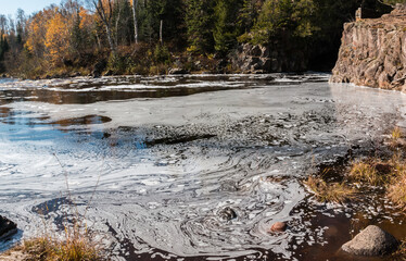 Swirling Patterns of Foam In The Temperance River,Temperance River State Park,Minnesota,USA