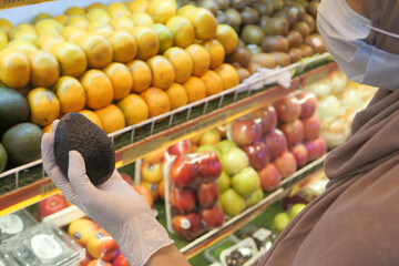 young women in gloves shopping at retail store 
