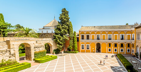 A view across the courtyard of the Alcazar Palace in Seville, Spain in the summertime