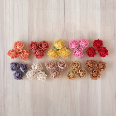 Artificial flowers made out of fabric in beautiful pastel color. This handmade flower can be used as decoration on headband, dress, and many other as craft supply material.