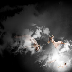 Fototapeta na wymiar Mid-air beauty cought in clouds. Full length shot of attractive young woman hovering in air and keeping eyes closed. Levitating in free falling, lack of gravity. Freedom, emotions, artwork concept.