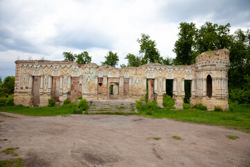 The ruins of the Palace von der Osten Saken on the border of the town of Nemeshaevo and the village of Mirotskoye, Kiev region, Ukraine. Abandoned old manor. The remains of a brick house.