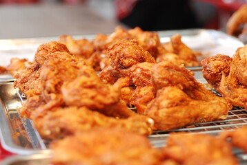 Fried chicken leg on street food.
