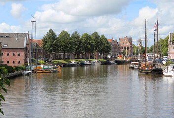 Fototapeta na wymiar View of the picturesque 'Grootdiep' canal in the historic town of Dokkum, Friesland in the summer.