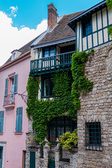 Fototapeta na wymiar Old French house in Paris Montmartre District. Montmartre is one of most colorful neighborhoods in Paris. France.