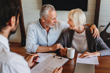 Male realtor make offer for sale to old customers indoors