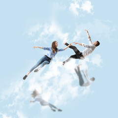 Obraz na płótnie Canvas Mid-air beauty cought in sky. Full length shot of attractive young woman and man hovering in air and keeping eyes closed. Levitating in free falling, lack of gravity. Freedom, emotions, artwork