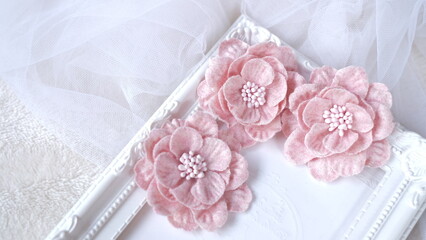Artificial flowers made out of fabric in beautiful pastel pink color