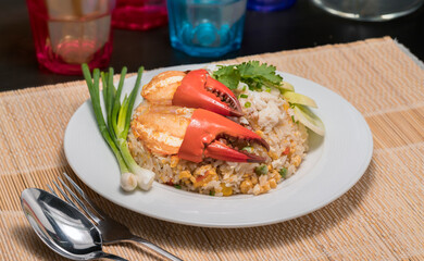 Delicious fried rice with crab, Fried rice with Sea crab and vegetable on white plate.