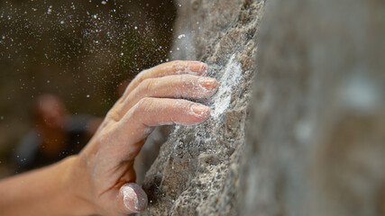 MACRO Rock climber's hand slips while trying to hold on to a natural sloper hold