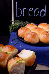 Golden round buns for burgers topped with sesame seeds