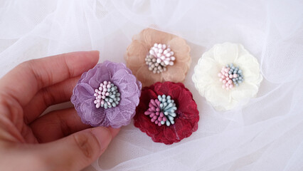 Artificial flowers made out of fabric in beautiful pastel colors