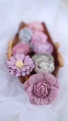 Artificial flowers made out of fabric in beautiful pastel colors