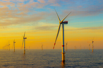 Offshore wind turbines at sunset