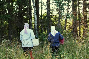 mother and daughter in autumn park