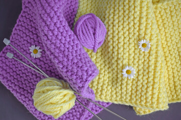 A warm lilac-yellow scarf, knitted with thick yarn.Handmade work.