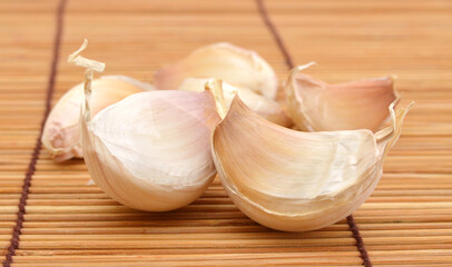 fresh garlic isolated on bamboo mat