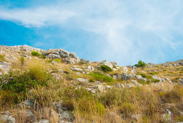 Fototapeta na wymiar Dry hills under the blue sky in Croatia