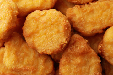 Fried chicken nuggets on whole background, close up