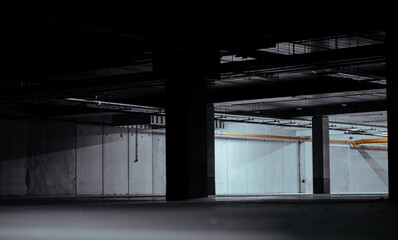 Obraz premium Entrance to underground car park during the day. Outdoor area is bright ,indoor area is dark.