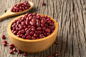 Red Beans in wooden bowl on wood plate background