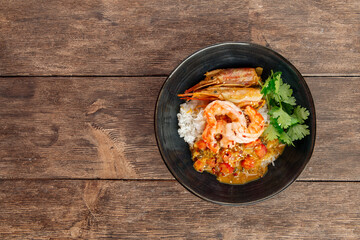 Asian dish curry with langoustines and hikari rice