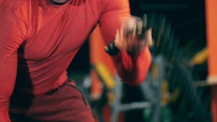 Male athlete during crossfit workout session with ropes
