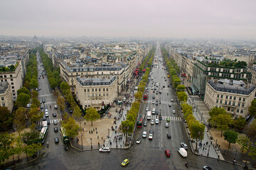 Aerial view of two streets of Paris with cars driving on the roads