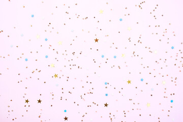 Glitters on a pink background, christmas and new year fun concept