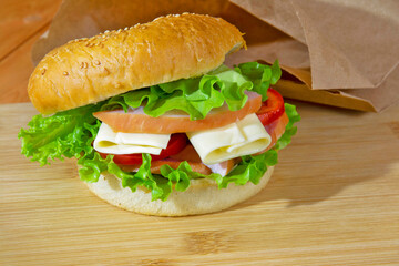 brisket sandwich with tomato and cheese and lettuce