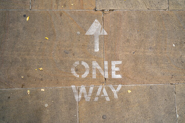 One way sign painted on the pavement in Oxford as part of social distancing measures