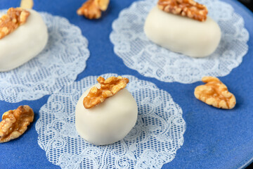 cameo decorated with walnut on a blue ceramic plate