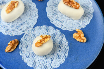 cameo decorated with walnut on a blue ceramic plate