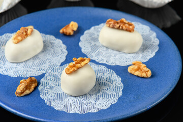 cameo decorated with walnut on a blue ceramic plate