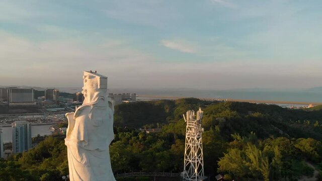 Aerial rotating around famous A-Ma Statue in Coloane, Macau