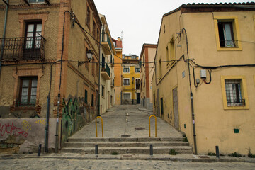Fototapeta na wymiar Architecture. Empty alley, paving stone street and sidewalk during coronavirus, Covid-19, pandemic.